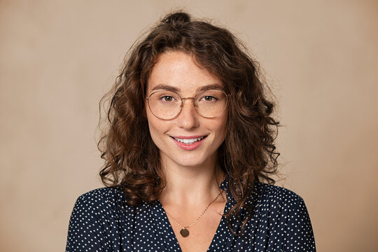 Portrait of happy young woman wearing spectacles