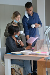Coworkers in office having a coffee break