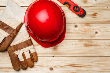 Hardhat and gloves of construction worker top view