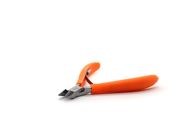 orange nail clippers on a white background