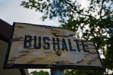 Sign old wooden Bus stop Bushalte Kralendijk Bonaire Caribbean sea