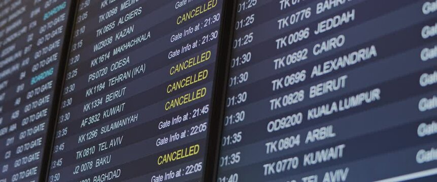 Close up of flight schedule board with canceled flights information