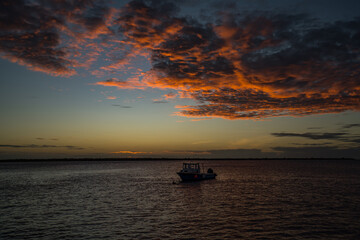 Sunset with boat Bonaire Caribbean sea