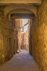 Fototapeta premium A covered alley in the village of Montemerano near Manciano in Grosseto province, Tuscany, Italy 