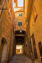 A covered alley in the village of Montemerano near Manciano in Grosseto province, Tuscany, Italy
