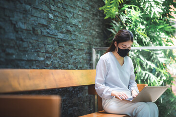 Fototapeta na wymiar young Asian woman wearing surgical face mask for health protection, disease virus flu epidemic