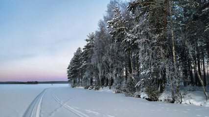 Russia, Karelia, Kostomuksha. The ski trail runs along the shore of the lake.January 04, 2021.
