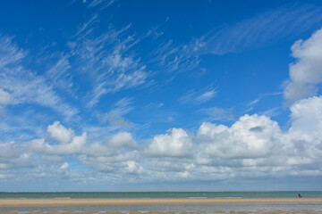Fototapeta na wymiar Beach by the sea with clouds on the sky