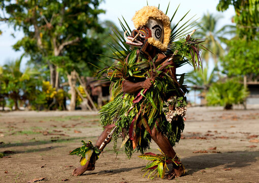 Malagan tatuana masks dance during a funeral ceremony, New Ireland Province, Langania, Papua New Guinea