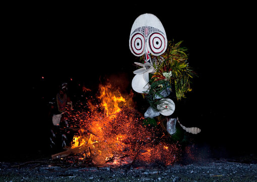 Dancer with a giant mask during a Baining tribe fire ceremony, East New Britain Province, Rabaul, Papua New Guinea
