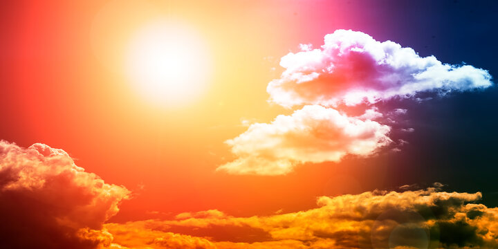 Bright multi-colored sky with clouds and sun. Panoramic image for your background.