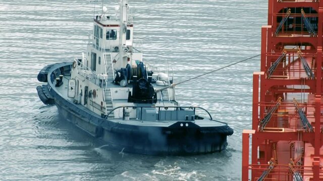 Tug Boat towing a Container Ship on the Rio de la Plata River, Buenos Aires, Argentina, South America, Seen from the Container Ship.