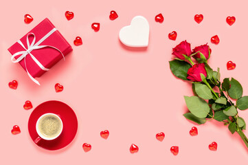 Red roses bouquet, gift box, coffee cup and hearts on pink background. Mother's, women's or Valentine's day celebration. Love and dating concept. Flat lay, copy space for text