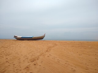 Wooden fishing boat on the seashore