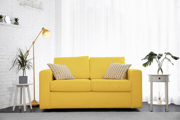 Color of the year 2021. Stylish room interior with yellow sofa