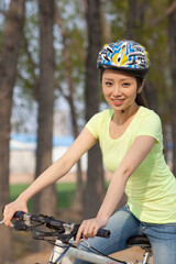 A young beauty women on a bicycle