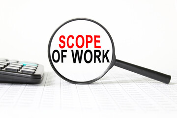 words SCOPE OF WORK in a magnifying glass on a white background. business concept