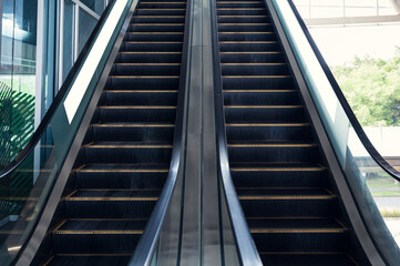 Electric escalators with railing moving up and down