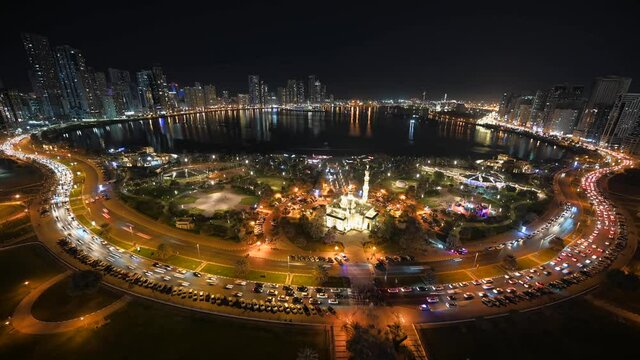 SHARJAH 2021: Stunning Night Timelapse of Sharjah City, Panoramic Khalid Lagoon and city skyline, traffic movement at night, United Arab Emirate. 4k Footage