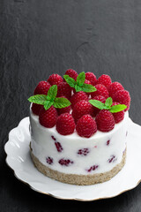 Diabetes approved no sugar cheese cake made with yoghurt and berry on black stone background