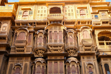Beautiful details carved facade wall and windows exterior architecture in Patwon Ki Haveli in Jaisalmer, rajasthan India. This is Famous Haveli Architecture in Rajasthan.