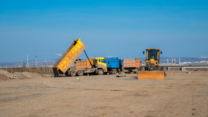 Road construction site. Laying a new road in the steppe. Ust-Kamenogorsk (Kazakhstan). 2020.