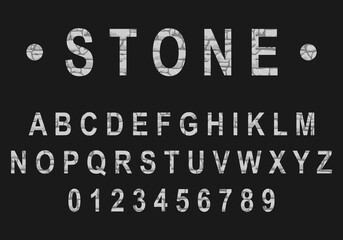 Font in the form of a natural stone on a black background. Realistic stone font. Vector, cartoon illustration. Vector.