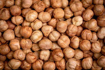 A lot of shelled nuts hazelnut close up. Natural background for the concept of healthy eating.