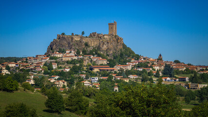 Fototapeta na wymiar The Fortress of Polignac (Auvergne, France) was built on an impressive volcanic platform and is watching over the countryside