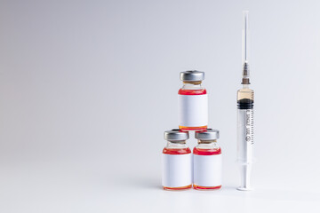 medicine vaccine vials with blank label for text isolated over gray background. studio shot. vaccine concept