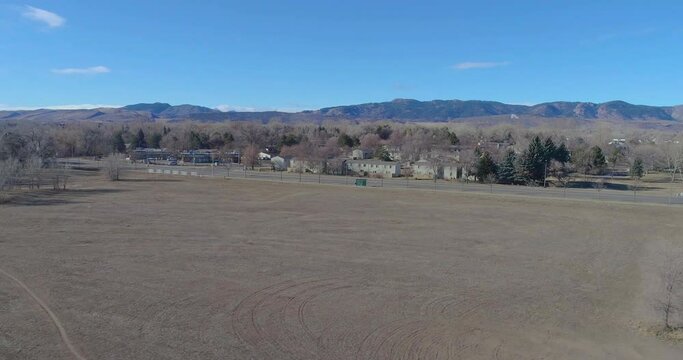 Fort Collins Colorado drone flight near the Rocky Mountains in the last week of 2020.  Clear blue sky and unseasonably warm weather. Traffic is slow and the ground is dry.