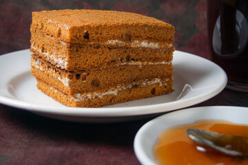 honey cake lies on a white plate