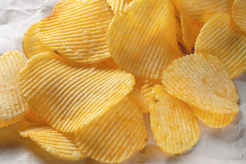 potato chips lie on light gray paper