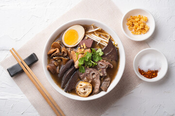 Chinese roll noodle soup with crispy pork.Top view.