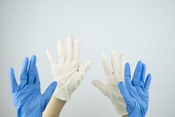 Obraz premium hands in rubber medical gloves raised up close up