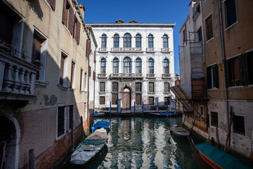 A small harbor for mooring and gondola is popular for sightseeing boat rides in the Venice city.