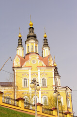 Fototapeta na wymiar The building of the Orthodox Church in Russia is yellow