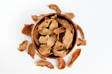 Slices of dried pears on white background. Dried fruits scattered on white background.