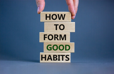 Build good habits symbol. Wooden blocks with words 'how to form good habits'. Male hand. Beautiful...