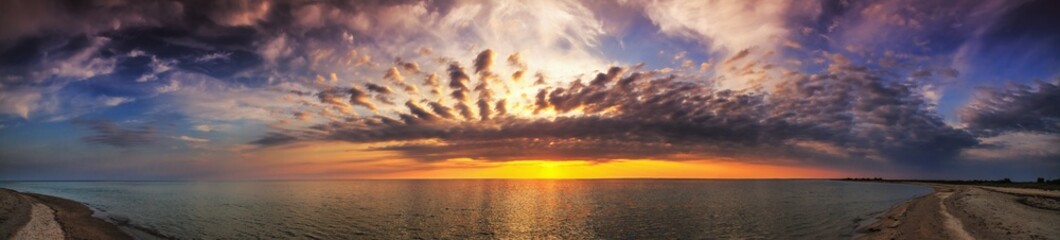 Beautiful summer sunset, view of the sea on sand spit, panorama, banner