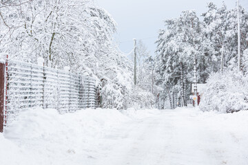 snowy winter on the streets of a small town in january 2021