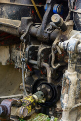 Tractor and cardan shaft for coupling equipment, tractor in the field during haymaking.