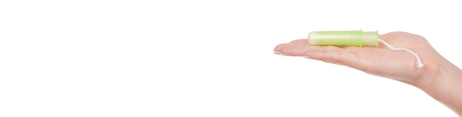 Hand with Female cotton tampon, menstrual cycle. Isolated on white background.
