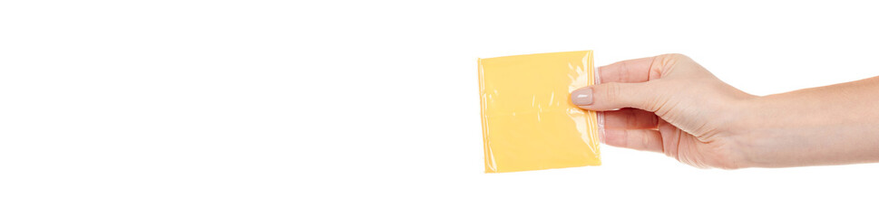 Hand with yellow square cheddar cheese isolated on white background.