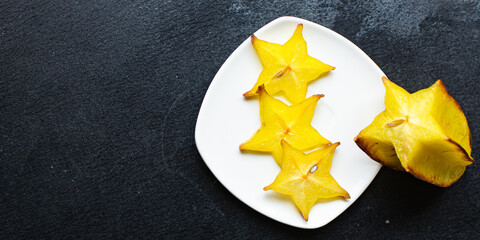 fresh carambola star fruit cut into slices ready to cook and eat on the table for healthy meal...