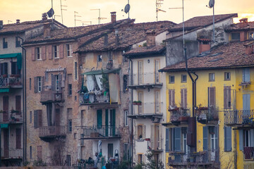 Ancient colorful houses on the riverside of Parma, Italy