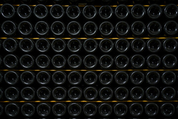 wine cellar, bottles of wine and champagne are stored under the ground of the winery. texture background