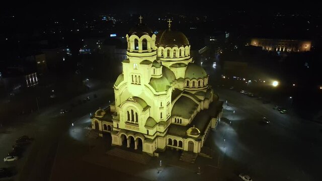 Drone orbiting around a cathedral on a foggy night in Sofia, Bulgaria