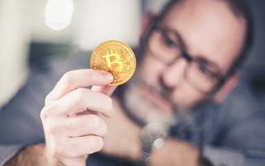 Bitcoin in hand of a businessman