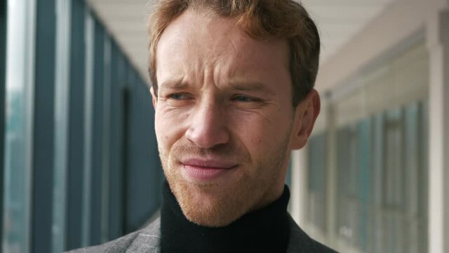 Awful idea. Disgusted young man feeling aversion, frowning face and shaking head no, Close-up of the face of a man shaking his head. Shakes his head and showing emotional a NO signal.